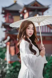 Explore Ethereal Asian Beauty: A Graceful Girl in White Ao Dai Amidst Ancient Oriental Charm - image 5