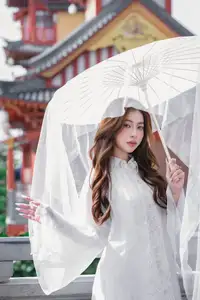 Explore Ethereal Asian Beauty: A Graceful Girl in White Ao Dai Amidst Ancient Oriental Charm - image 8