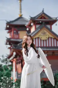 Explore Ethereal Asian Beauty: A Graceful Girl in White Ao Dai Amidst Ancient Oriental Charm - image 7