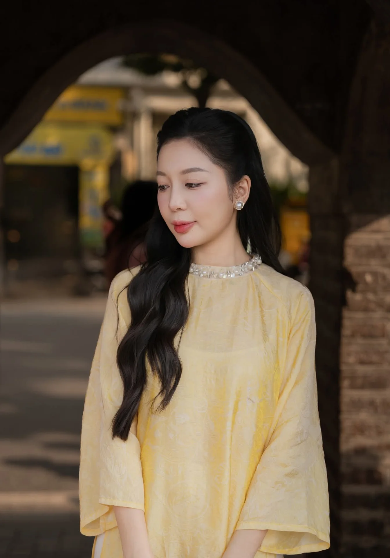 Graceful Vietnamese Beauty: Elegant Woman in Modern Traditional Attire Captures Asian Charm
