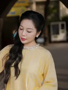 Graceful Vietnamese Beauty: Elegant Woman in Modern Traditional Attire Captures Asian Charm - image 5