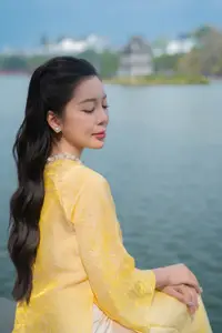 Graceful Vietnamese Beauty: Elegant Woman in Modern Traditional Attire Captures Asian Charm - image 1