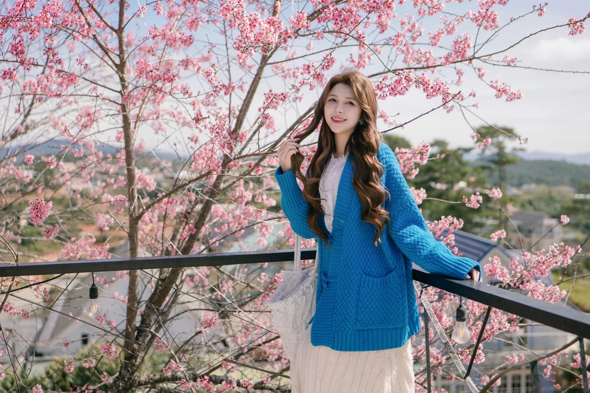 Dreamy muse amidst the blooming cherry blossoms in Da Lat
