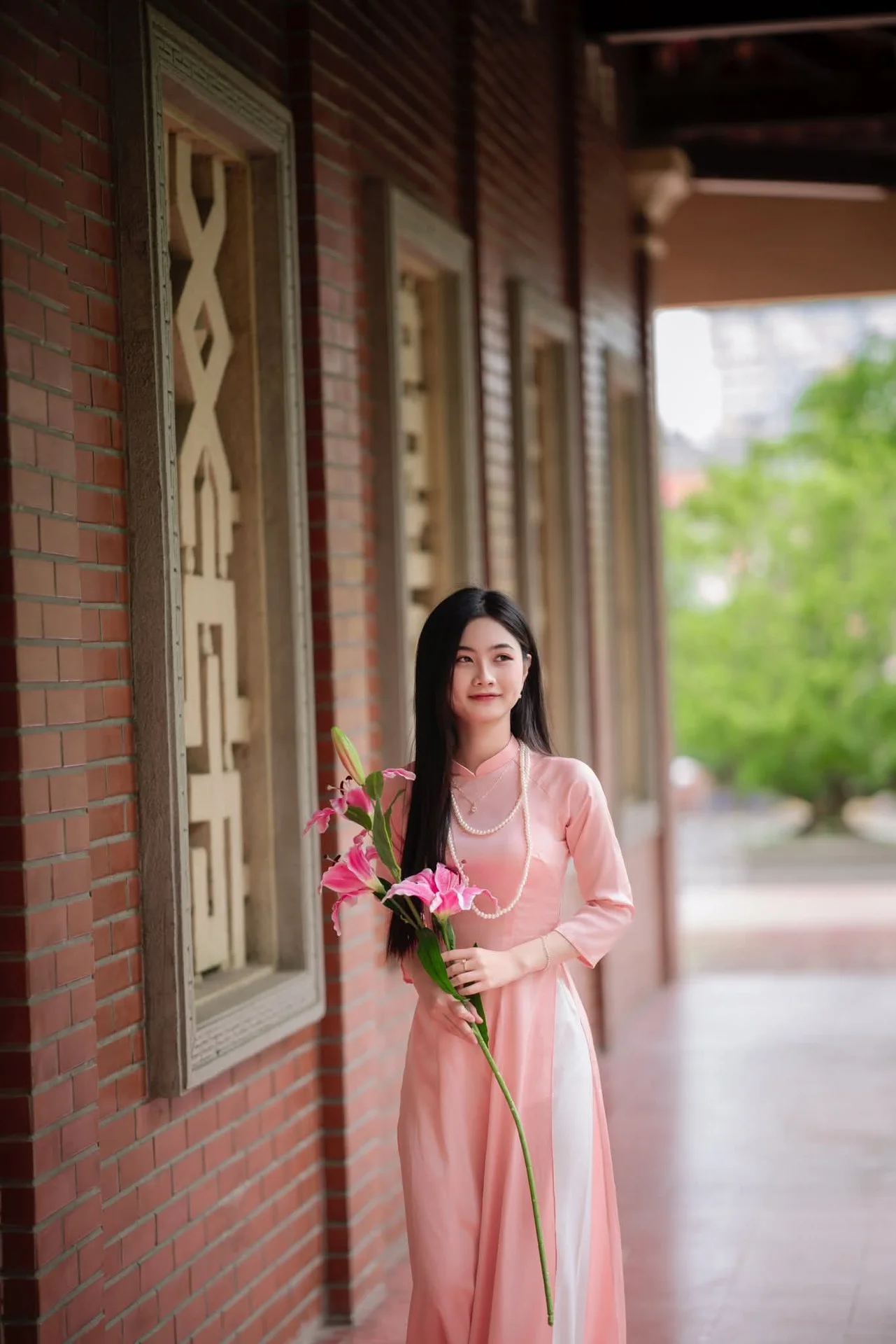 Elegant Vietnamese Beauty Amidst Ancient Architecture