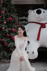 Christmas Radiance: Girl in Elegant White Dress and Joyful Smile - image 0