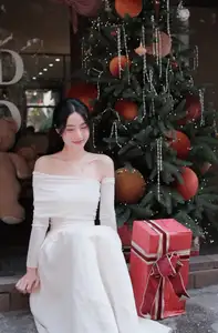 Christmas Radiance: Girl in Elegant White Dress and Joyful Smile - image 4