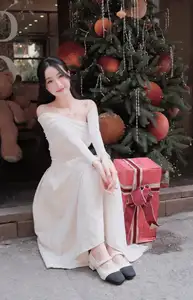 Christmas Radiance: Girl in Elegant White Dress and Joyful Smile - image 3