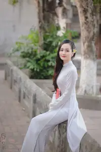 Graceful Vietnamese Girl in White Ao Dai, Radiant Smile at Ancient Site 1000026917 - image 17