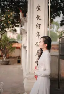 Graceful Vietnamese Girl in White Ao Dai, Radiant Smile at Ancient Site 1000026917 - image 2