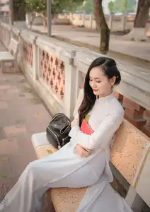 Graceful Vietnamese Girl in White Ao Dai, Radiant Smile at Ancient Site 1000026917 - image 4