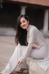 Graceful Vietnamese Girl in White Ao Dai, Radiant Smile at Ancient Site 1000026917 - image 11