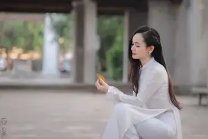 Graceful Vietnamese Girl in White Ao Dai, Radiant Smile at Ancient Site 1000026917 - image 3