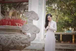 Graceful Vietnamese Girl in White Ao Dai, Radiant Smile at Ancient Site 1000026917 - image 19