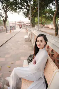 Graceful Vietnamese Girl in White Ao Dai, Radiant Smile at Ancient Site 1000026917 - image 5