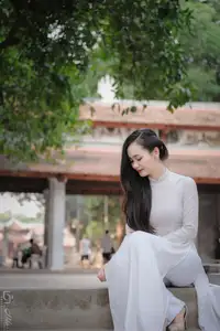 Graceful Vietnamese Girl in White Ao Dai, Radiant Smile at Ancient Site 1000026917 - image 9