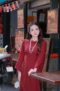 Elegant Vietnamese Beauty: A Girl in Red Ao Dai with Lilies Captivates Urban Charm - image 4