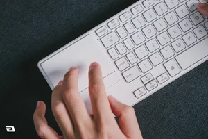 Affordable Slim Keyboard with Integrated Trackpad for Minimalist Setups - image 0