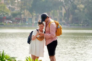 Hanoi's Hoan Kiem Lake Crowded with Tourists During Sunny Lunar New Year Celebrations - image 22