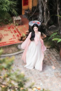 Ethereal Muse in Traditional Silk and Ancient Architecture - image 0