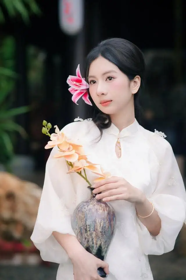 Elegant Vietnamese Beauty with Flowers