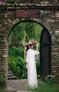Elegant Vietnamese Beauty with Flowers - image 8