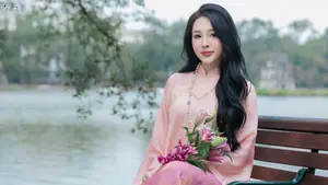 Discover the Elegant Charm of Vietnamese Beauty in a Pink Ao Dai by the Serene Lake - image 6