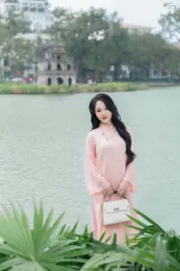 Discover the Elegant Charm of Vietnamese Beauty in a Pink Ao Dai by the Serene Lake - image 4