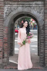 Discover the Elegant Charm of Vietnamese Beauty in a Pink Ao Dai by the Serene Lake - image 2