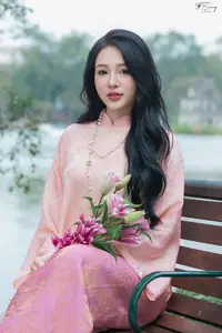Discover the Elegant Charm of Vietnamese Beauty in a Pink Ao Dai by the Serene Lake - image 5