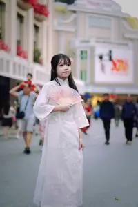 Graceful Vietnamese Girl in White Ao Dai Shines with Traditional Beauty in Old Quarter - image 8
