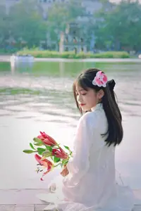 Graceful Vietnamese Girl in White Ao Dai Shines with Traditional Beauty in Old Quarter - image 7