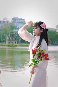 Graceful Vietnamese Girl in White Ao Dai Shines with Traditional Beauty in Old Quarter - image 4