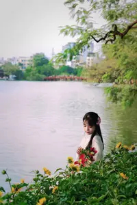 Graceful Vietnamese Girl in White Ao Dai Shines with Traditional Beauty in Old Quarter - image 1
