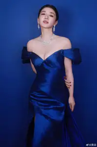 Radiant in Blue: A Woman's Elegant Charm Shines Bright in a Luxurious - image 8