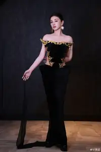 Radiant in Blue: A Woman's Elegant Charm Shines Bright in a Luxurious - image 1
