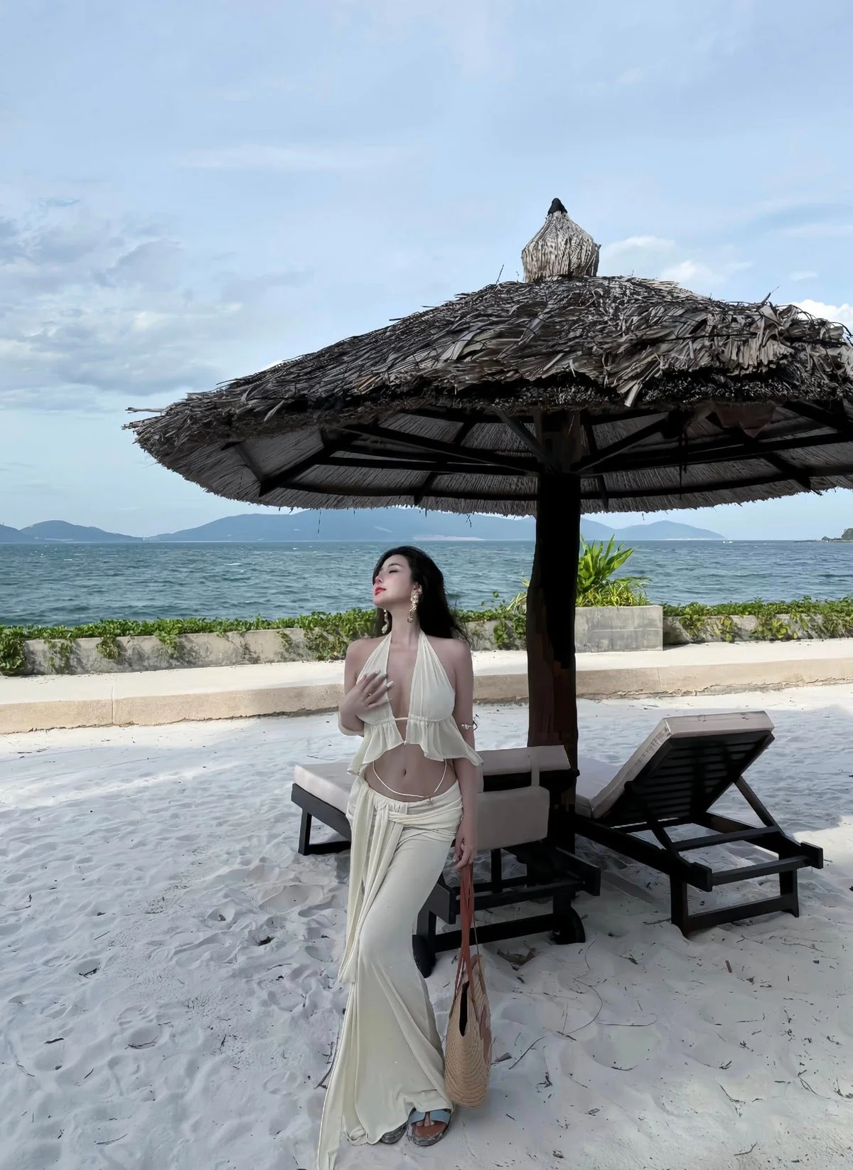 Saigon Influencer Vo Ngoc Tran Stuns in Bold Cut-Out Beach Dress Fashion