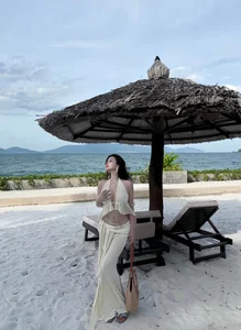 Saigon Influencer Vo Ngoc Tran Stuns in Bold Cut-Out Beach Dress Fashion - image 7