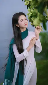 VGU No.172: Captivating Vietnamese Ao Dai Student in a Dreamy Moment, Showcasing Pure Grace Amidst Nature. - image 0