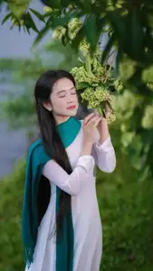 VGU No.172: Captivating Vietnamese Ao Dai Student in a Dreamy Moment, Showcasing Pure Grace Amidst Nature. - image 1