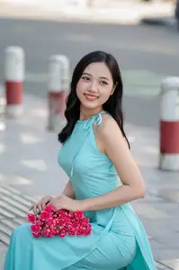 Charming Vietnamese Girl in Turquoise Ao Dai: Elegant Beauty on City Streets - image 6