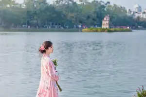 Elegant Asian Beauty: Graceful Woman in Modern Ao Dai by Serene Lakeside - image 2