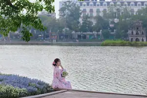 Elegant Asian Beauty: Graceful Woman in Modern Ao Dai by Serene Lakeside - image 0