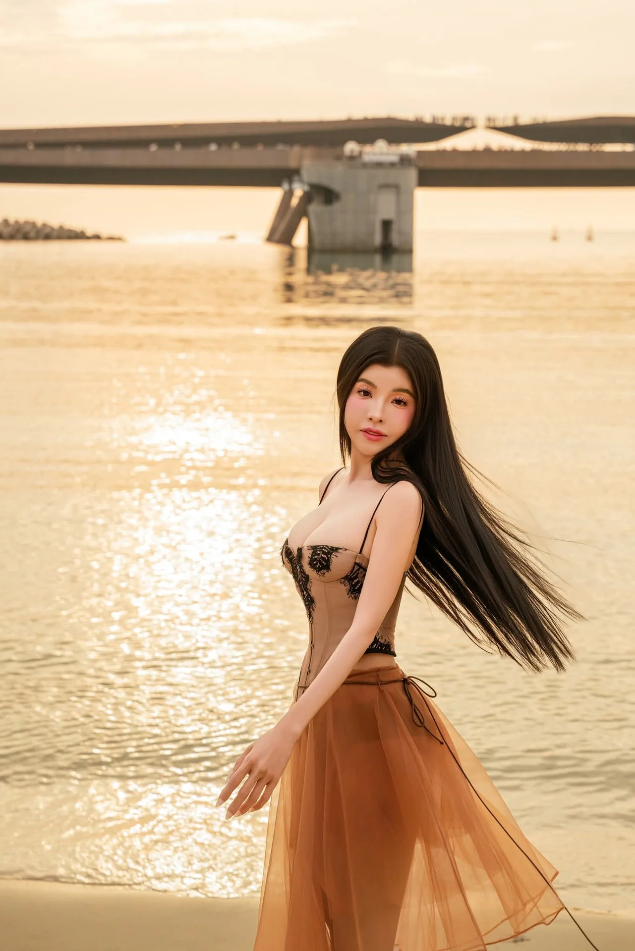 Golden Hour Serenity: Young Woman's Graceful Beach Walk