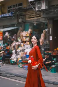 Vietnamese Girl's Bright Smile with Lucky Plush Horses in a Traditional Market. - image 1