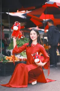 Vietnamese Girl's Bright Smile with Lucky Plush Horses in a Traditional Market. - image 0