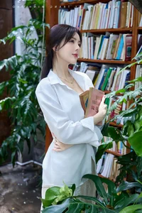 Lilly Luta Captivates Fans with Pure and Elegant White Shirt Photoshoot - image 0
