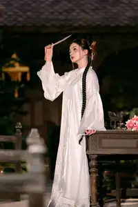 Enchanting Vietnamese Beauty A Girl with Long Braids in Traditional Attire on a Magical Night - image 5