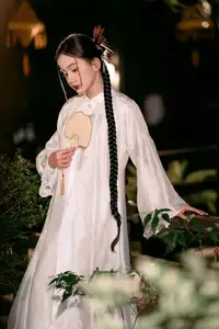 Enchanting Vietnamese Beauty A Girl with Long Braids in Traditional Attire on a Magical Night - image 3