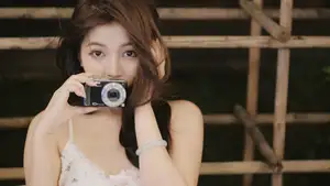 Captivating East Asian Beauty in Floral Slip Dress with Vintage Camera - image 7