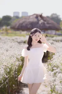 Ethereal Beauty: Young Woman in White Dress with Bouquet Amidst Dreamy Clouds - image 4
